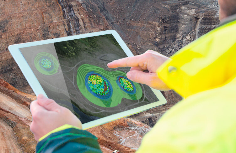Man using software at mine site