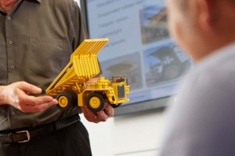 Man holding lego truck